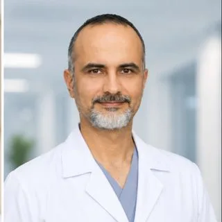 Op. Dr. Özcan Ulaş Açıkgöz — Göz Hastalıkları, Ankara. Portre fotoğrafı.