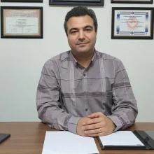 Doç. Dr. Tolga Kurt — Çanakkale. Portre fotoğrafı.