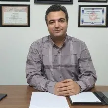 Doç. Dr. Tolga Kurt — Çanakkale. Portre fotoğrafı.