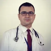 Uzm. Dr. Osman Ziya Arık — Kardiyoloji, Kozan, Adana. Portre fotoğrafı.