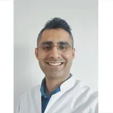Doç. Dr. Hasan Camcı — Ortodonti. Portre fotoğrafı.