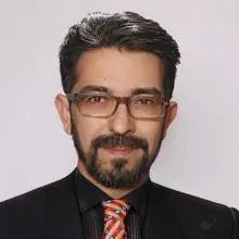 Dr. Öğr. Üyesi Özmen Metin — Psikiyatri, Antalya. Portre fotoğrafı.