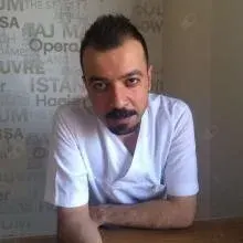 Dt. Doğan Yeşilçayır — Diş Hekimi. Portre fotoğrafı.