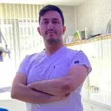 Dt. Hüdai Ali Ertaş — Diş Hekimi, Kayseri. Portre fotoğrafı.