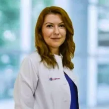 Uzm. Dr. Aslı Tutan — Psikiyatri, İzmir. Portre fotoğrafı.