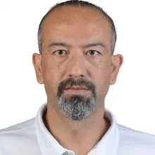 Dr. Öğr. Üyesi Şeref Şimşek — Çocuk ve Ergen Psikiyatrisi, Antalya. Portre fotoğrafı.