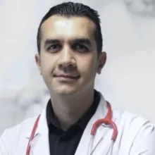 Uzm. Dr. Ahmet Gökhan Uslan — Çocuk Sağlığı Ve Hastalıkları, Aydın. Portre fotoğrafı.