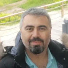 Doç. Dr. Yılmaz Akbaş — Çocuk nörolojisi, Hatay. Portre fotoğrafı.