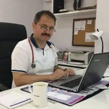 Doç. Dr. Emin Mete — Denizli. Portre fotoğrafı.