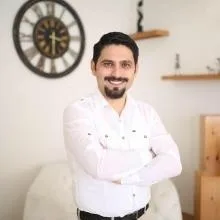 Uzm. Dr. Mustafa Erkan — Çocuk ve Ergen Psikiyatrisi. Portre fotoğrafı.