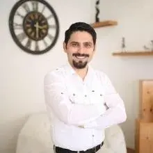 Uzm. Dr. Mustafa Erkan — Çocuk ve Ergen Psikiyatrisi. Portre fotoğrafı.
