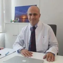 Doç. Dr. Can Tekin İskender — Ankara. Portre fotoğrafı.
