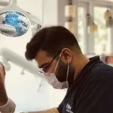 Dt. Mehmet Mustafa Doğan — Diş Hekimi, Adana. Portre fotoğrafı.