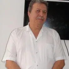 Dt. Mehmet İşlek — Diş Hekimi, Antalya. Portre fotoğrafı.