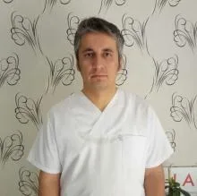 Uzm. Dr. Kamuran Ay — Ankara. Portre fotoğrafı.