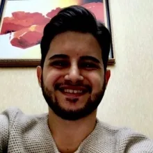 Dt. Sertaç Gündoğdu — Diş Hekimi. Portre fotoğrafı.