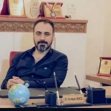 Dr. Ferman Koca — Pratisyen, İstanbul. Portre fotoğrafı.