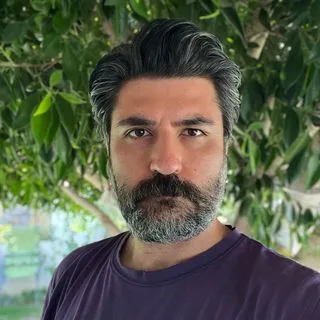Uzm. Dr. Görkem Yılmaz — Psikiyatri, İstanbul. Portre fotoğrafı.