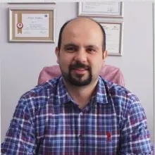 Uzm. Dt. Aykut Önol — Antalya. Portre fotoğrafı.