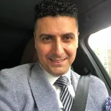 Uzm. Dt. Doğan Öz — Ağız Diş Ve Çene Cerrahisi, Adana. Portre fotoğrafı.