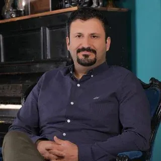 Doç. Dr. Barış Güller — Çocuk ve Ergen Psikiyatrisi. Portre fotoğrafı.