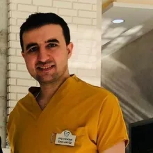 Dt. Emre Akyüz — Diş Hekimi, Mersin. Portre fotoğrafı.